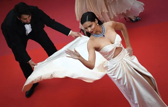 Brazilian model Adriana Lima poses as she arrives on May 16, 2018 for the screening of the film “Burning” at the 71st edition of the Cannes Film Festival in Cannes, southern France. (Photo by Anne-Christine Poujoulat/AFP Photo)