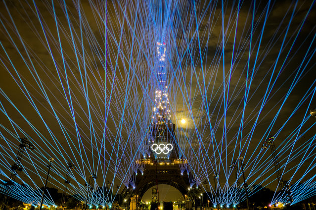 Light shows of the Eiffel Tower are performed during the Paris 2024 Olympics opening ceremony rehearsals, which is to be held on July 26, in Paris, France on July 24, 2024. (Photo by Mustafa Ciftci/Anadolu via Getty Images)