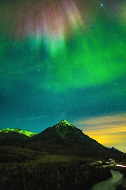 This photo shows the Northern Lights (aurora borealis), the Milky Way Galaxy, the night sky, and the last colors of sunset on the horizon all at once in the Chickaloon region of Alaska, United States, on September 30, 2025. The image is considered a remarkable example documenting the simultaneous observation of these four natural phenomena, which rarely occur together at high latitudes. (Photo by Hasan Akbas/Anadolu via Getty Images)
