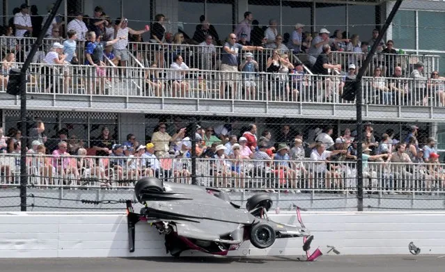 Andretti Autosport driver Kyle Kirkwood (27) slides across the SAFER barrier through the second turn after a crash with Arrow McLaren SP driver Felix Rosenqvist (not pictured) during the 107th running of the Indianapolis 500 at Indianapolis Motor Speedway in Indianapolis, Indiana on May 28, 2023. (Photo by Jef Richards/USA TODAY Sports)