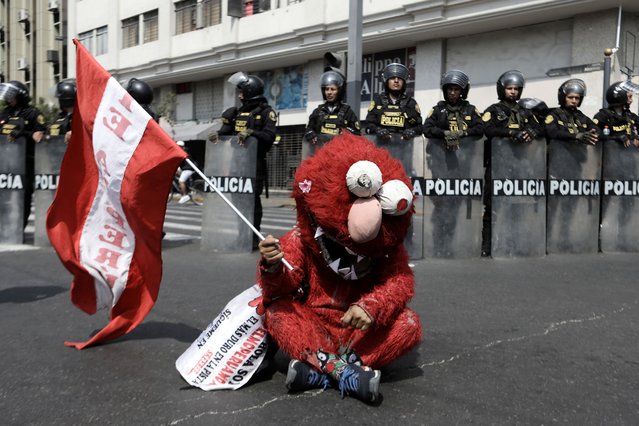 Police take security measure as the Peruvian transport workers begin a national protest demanding action against the wave of extortion and growing insecurity affecting the country on October 23, 2024, in Lima, Peru. (Photo by Klebher Vasquez/Anadolu via Getty Images)