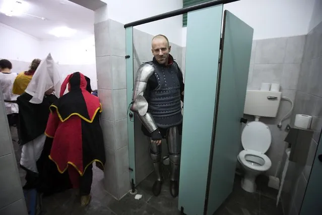 A competitor from Denmark is seen at the dressing room during the “World Medieval Fighting Championship – the Israeli Challenge” in Rishon Letzion near Tel Aviv on January 22, 2015. (Photo by Amir Cohen/Reuters)