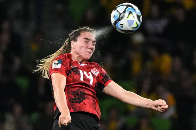 Canada's defender #14 Vanessa Gilles heads the ball during the Australia and New Zealand 2023 Women's World Cup Group B football match between Canada and Australia at Melbourne Rectangular Stadium, also known as AAMI Park, in Melbourne on July 31, 2023. (Photo by William West/AFP Photo)