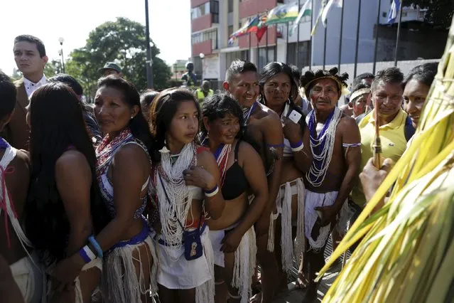 Venezuelan Indians from the Amazon tribes attend a gathering in support of the deputies of the Venezuelan coalition of opposition parties (MUD) at the Supreme Court in Caracas January 13, 2016. Three Venezuelan opposition lawmakers were giving up their seats on Wednesday to unblock a power dispute between President Nicolas Maduro's government and the newly opposition-led National Assembly. (Photo by Marco Bello/Reuters)