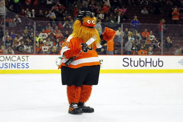 The Philadelphia Flyers mascot, Gritty, takes to the ice during the first intermission of the Flyers' preseason NHL hockey game against the Boston Bruins, Monday, September 24, 2018, in Philadelphia. (Photo by Tom Mihalek/AP Photo)