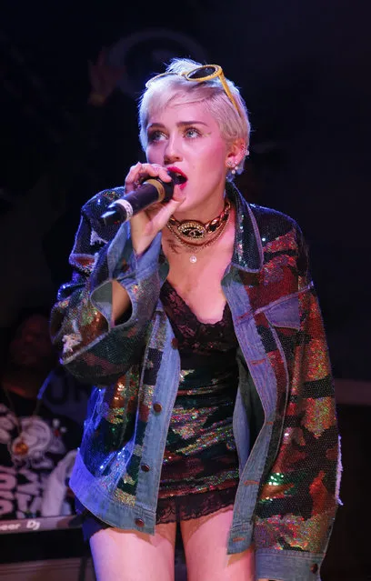 Miley Cyrus appears onstage for a Mike Will Made It performance at the Fader Fort Presented by Converse during the SXSW Music Festival on Thursday, March 19, 2015 in Austin, Texas. (Photo by Jack Plunkett/Invision/AP Photo)
