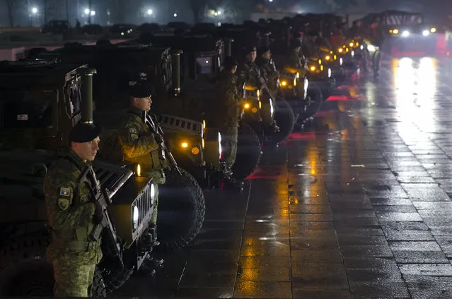 Soldiers of Kosovo Security Force line up to displaying their equipment at the end of the army formation ceremony in capital Pristina, Kosovo on Friday, December 14, 2018. Kosovo's parliament convened on Friday to approve the formation of an army, a move that has angered Serbia which says it would threaten peace in the war-scarred region. (Photo by Visar Kryeziu/AP Photo)