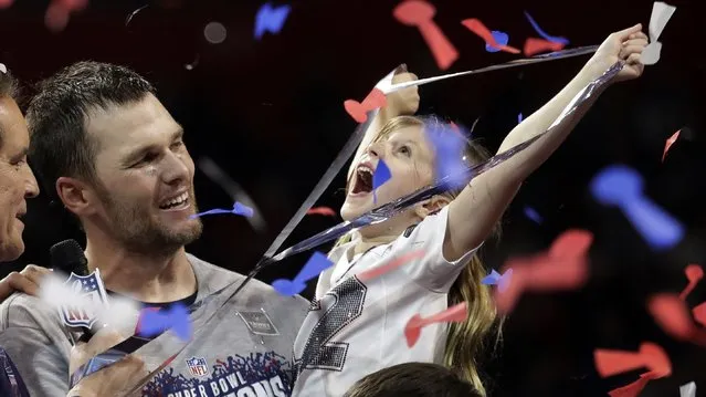 New England Patriots' Tom Brady holds his daughter, Vivian, after the NFL Super Bowl 53 football game against the Los Angeles Rams, Sunday, February 3, 2019, in Atlanta. The Patriots won 13-3. (Photo by Lynne Sladky/AP Photo)