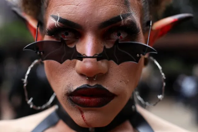 A person dressed as a horror creature attends the Zombie Walk, during the holiday of Dia de Finados (All Souls' Day) in Sao Paulo, Brazil on November 2, 2022. (Photo by Carla Carniel/Reuters)