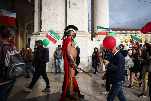 People take part in the demonstration in support of the revolution in Iran, in Lisbon, Portugal, 19 November 2022. In memory of the over 3,000 Islamic Republic victims who were killed during the 2019 protests in Iran and as a show of support for the current revolution in that country, a global day of action is taking place in 25 countries, including the US, UK, Spain, Germany, France, Japan, Australia, among others. (Photo by Rodrigo Antunes/EPA/EFE)