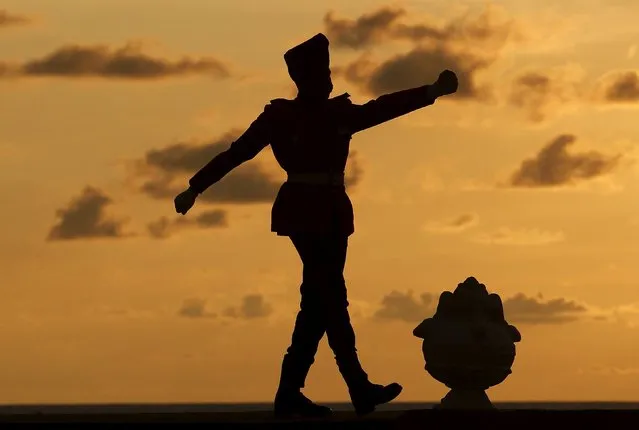 A soldier marches at flag square at Galle Face green in Colombo April 6, 2015. (Photo by Dinuka Liyanawatte/Reuters)