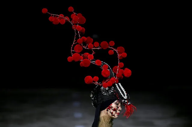 A model presents a creation by designer Hu Sheguang at China Fashion Week in Beijing, China, March 25, 2019. (Photo by Jason Lee/Reuters)