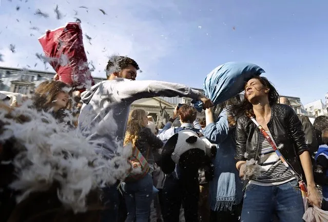 Romanian young people fight with pillows during the International Pillow Fight Day in Bucharest, Romania, 02 April 2016. (Photo by Robert Ghement/EPA)