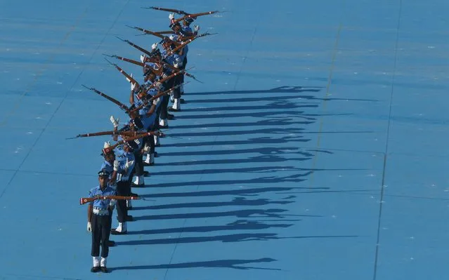 Indian Air Force (IAF) Air Warrior drill team displays rifle handling skills during a combined graduation parade at Air Force Academy, outskirts of Hyderabad, India, Saturday, June 15, 2019. A total of 152 flight cadets including 24 women officers were commissioned as flying officers on Saturday on successful completion of their training, a press release said. (Photo by Mahesh Kumar A./AP Photo)