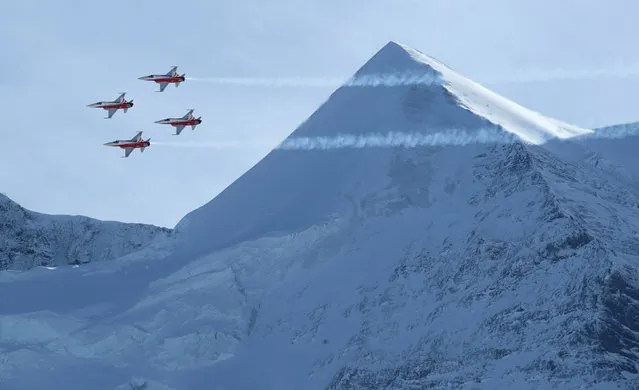 The Swiss Air Force Patrouille Suisse aerobatic team performs during the men's downhill race at the Alpine Skiing FIS Ski World Cup in Wengen, Switzerland, Saturday, January 19, 2019. (Photo by Denis Balibouse/Reuters)