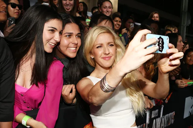 Recording artist Ellie Goulding (R) poses for a selfie with fans at the 2014 MTV Movie Awards at Nokia Theatre L.A. Live on April 13, 2014 in Los Angeles, California. (Photo by Christopher Polk/Getty Images for MTV)