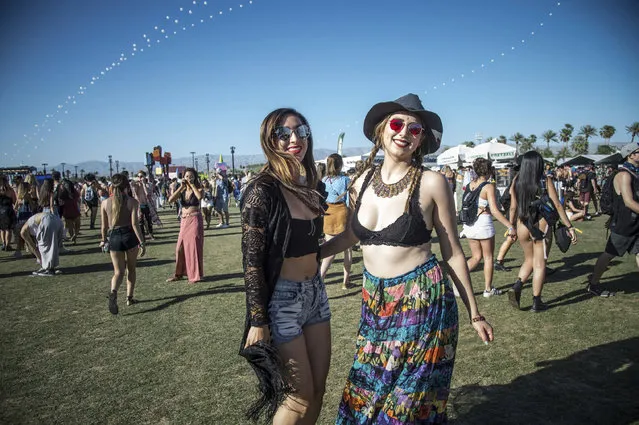 Festival goers Holguin Sayia, left, and Ochoa Nidia pose at Coachella Music & Arts Festival at the Empire Polo Club on Friday, April 14, 2017, in Indio, Calif. (Photo by Amy Harris/Invision/AP Photo)