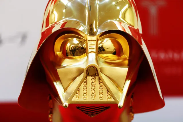Japan's jeweler Tanaka Kikinzoku displays a pure gold made Darth Vader mask, weighing 10kg and priced 154 million yen (1.4 million US dollars) at their Ginza shop on April 25, 2017 in Tokyo, Japan. The mask will be on sale on May 4th, to celebrate the day of Star Wars as May the Fourth in the movie. (Photo by Aflo/Barcroft Images)