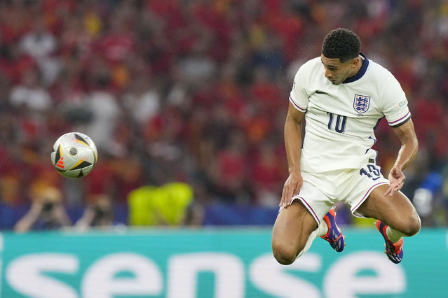 England's Jude Bellingham heads the ball during the final match between Spain and England at the Euro 2024 soccer tournament in Berlin, Germany, Sunday, July 14, 2024. (Photo by Martin Meissner/AP Photo)