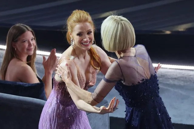 Jessica Chastain congratulates Linda Dowds Oscar for Best Makeup and Hairstyling for “The Eyes of Tammy Faye” at the 94th Academy Awards in Hollywood, Los Angeles, California, U.S., March 27, 2022. (Photo by Brian Snyder/Reuters)