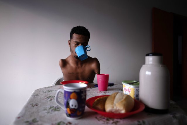 Brazilian paralympic swimmer Gabriel Geraldo dos Santos Araujo has lunch before training in Juiz de Fora, state of Minas Gerais, Brazil on July 9, 2024. Gabriel, gold and silver medalist in Tokyo 2020 and now preparing for the Paris 2024 Paralympic Games, has phocomelia, a congenital disease which prevents the normal formation of arms and legs. He discovered swimming through a Physical Education teacher at the school where he studied. (Photo by Douglas Magno/AFP Photo)