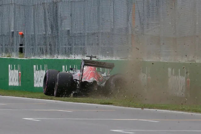 Red Bull driver Carlos Sainz of Spain crashes into the wall during qualifying at the F1 Canadian Grand Prix auto race, Saturday, June 11, 2016, in Montreal. (Photo by Chris Wattie/Reuters)