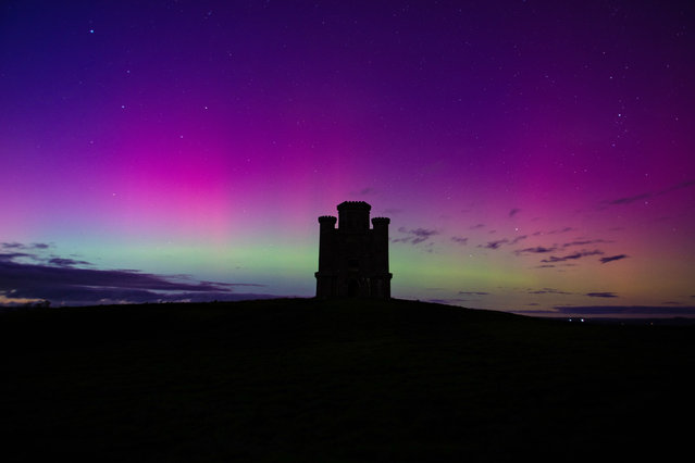 Northern lights appear behind Paxton's Tower in Llanarthne, United Kingdom on October 10, 2024. (Photo by Joann Randles/Cover Images)