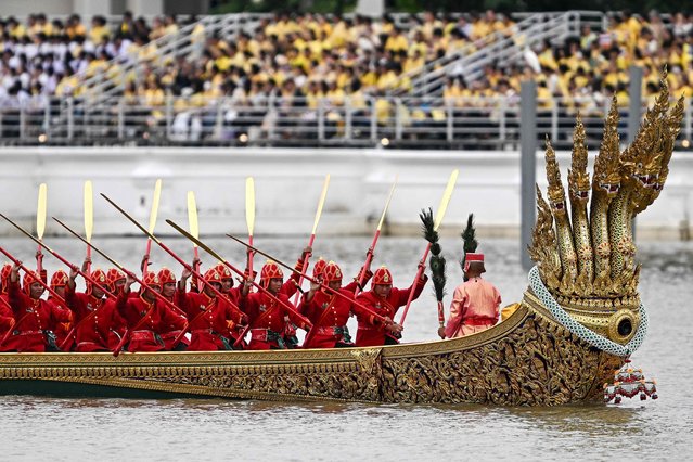 Thai oarsmen row a royal barge during the Royal Barge Procession along the Chao Phraya River in Bangkok on October 27, 2024. (Photo by Manan Vatsyayana/AFP Photo)