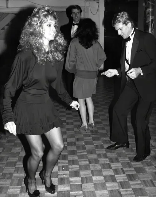 Farrah Fawcett and Ryan O'Neal attends a party at Studio 54 on December 4, 1981 in New York City. (Photo by Robin Platzer/Images/Getty Images)