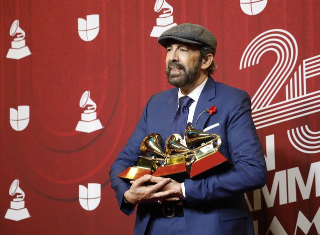 Dominican singer and composer Juan Luis Guerra poses with Best Tropical Song and Record Of The Year for “Mambo 23”, and Best merenguebachata album for Radio Guira at the 25th Annual Latin Grammy Awards in Miami, Florida, U.S., November 14, 2024. (Photo by Marco Bello/Reuters)