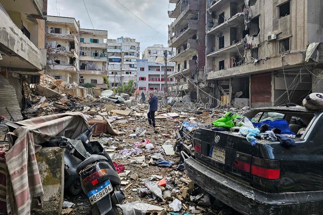 A man walks amid destruction in Beirut's southern Haret Hreik neighbourhood a day after an Israeli airstrike targeted the site, on November 18, 2024, as the war between Israel and Lebanon's Hezbollah group continues. (Photo by AFP Photo/Stringer)