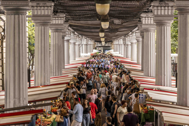 People shop in a market on July 21, 2024 in Paris, France. The city is gearing up to host the XXXIII Olympic Summer Games, from 26 July to 11 August. (Photo by Maja Hitij/Getty Images)