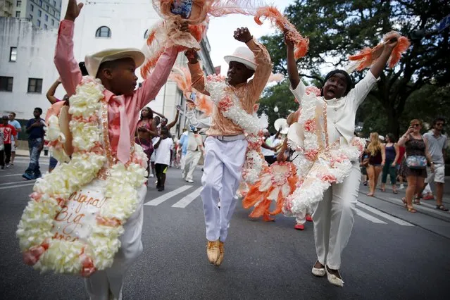 The Original Big 7 Junior Steppers parade through the Central Business District in a second line parade to mark the tenth anniversary of Hurricane Katrina in New Orleans, Louisiana August 29, 2015. (Photo by Edmund D. Fountain/Reuters)