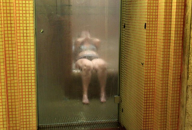 A bather relaxes in a steam cabin at the Lukacs Bath in Budapest, Hungary June 28, 2016. (Photo by Bernadett Szabo/Reuters)