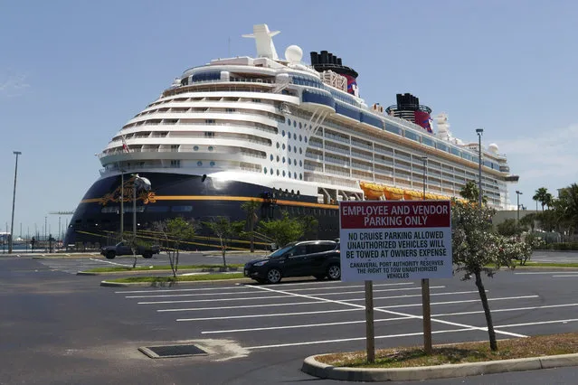 Due to the coronavirus, a Disney cruise ship is docked at Port Canaveral, Saturday, April 4, 2020, in Cape Canaveral, Fla. Disney cruises are suspended till further notice. (Photo by John Raoux/AP Photo)