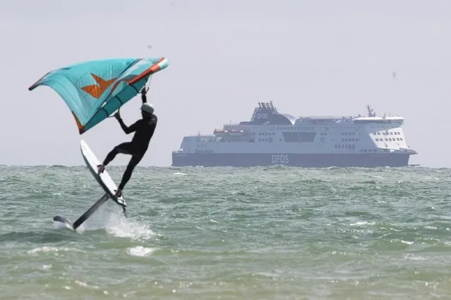 It was a nice day on August 3, 2022 to take the hydrofoil board out at St Margaret’s Bay, near Dover. There will be sunny spells for most today but the north will have some scattered showers. (Photo by Joshua Bratt/The Times)