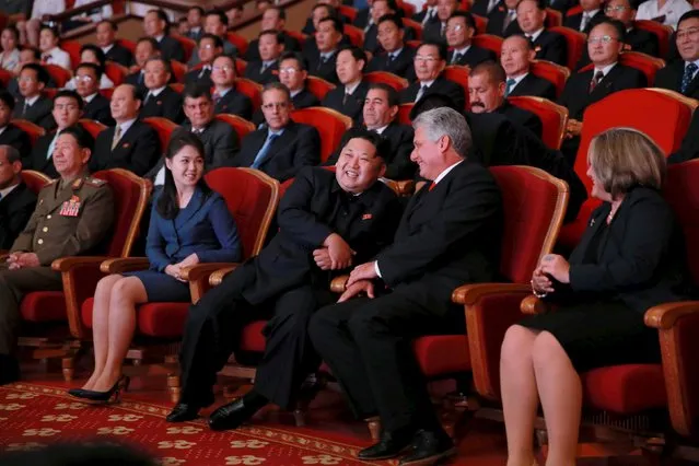 North Korean leader Kim Jong Un (center L) and Cuba's First Vice President Miguel Diaz-Canel (center R), attend a performance by the Moranbong Band and the State Merited Chorus in this undated photo released by North Korea's Korean Central News Agency (KCNA) in Pyongyang September 8, 2015. Also pictured is Kim's wife Ri Sol Ju (front 2nd L). (Photo by Reuters/KCNA)