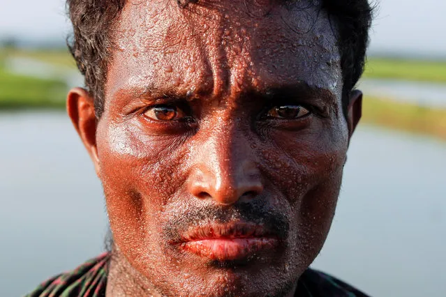 A Rohingya refugee man poses at the Bangladeshi side of the Naf river after crossing the border from Myanmar, near Palang Khali, Bangladesh October 16, 2017. (Photo by Jorge Silva/Reuters)
