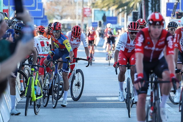 Cyclist in action near the finish line in Lagos, Portugal, 19 February 2025. The Commissioners' College of the 51st Volta ao Algarve cancelled the first stage of the race on 19 February after a problem that split the peloton, leading dozens of cyclists to miss the finish line. (Photo by Luis Forra/EPA)