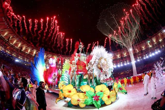 Carnival singers and dancers perform as fireworks explode near the conclusion of the Closing Ceremony on Day 16 of the Rio 2016 Olympic Games at Maracana Stadium on August 21, 2016 in Rio de Janeiro, Brazil. (Photo by Ezra Shaw/Getty Images)