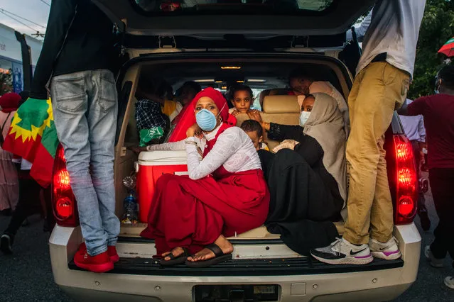 Demonstrators sit in the back of a trunk during a protest after the death of musician and activist Hachalu Hundessa on July 1, 2020 in St Paul, Minnesota. Hundessa, known for his protest songs which resonated within the Oromo ethnic group, was shot and killed in Ethiopia’s capital Addis Ababa on June 29, 2020. His death has sparked ongoing protests around the world. (Photo by Brandon Bell/Getty Images)