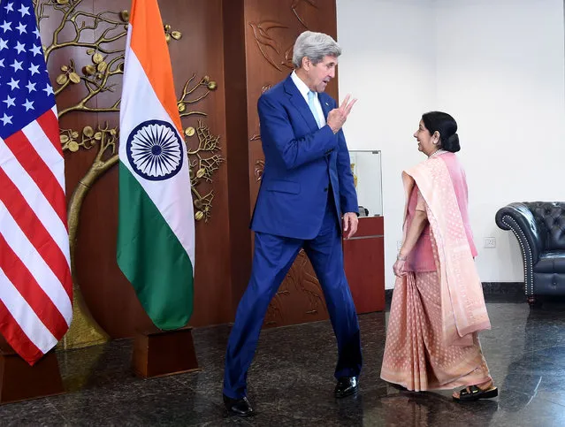 Indian Minister of External Affairs Sushma Swaraj (R) and US Secretary of State John Kerry arrive prior to a meeting in New Delhi on August 30, 2016. (Photo by Prakash Singh/AFP Photo)