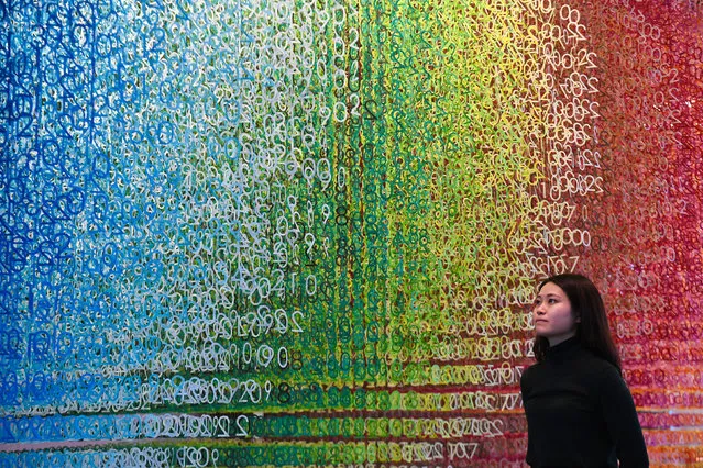 A gallery assistant looks at Slices Of Time by Emmanuelle Moureaux, at the NOW Gallery on the Greenwich Peninsula in London, England on February 4, 2020. (Photo by Kirsty O'Connor/PA Images via Getty Images)