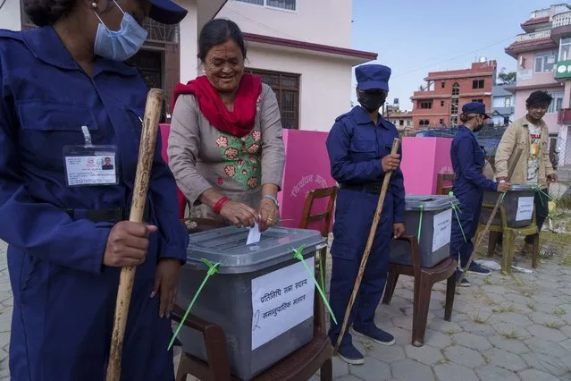 Nepalese people participate in a mock election as a part of an awareness program organized by the election commission ahead of the general elections, in Lalitpur, Nepal, Sunday, November 6, 2022. Nepal's parliamentary elections on Nov. 20 are the fourth since the Himalayan nation abolished a centuries-old monarchy and became a republic. (Photo by Niranjan Shrestha/AP Photo)