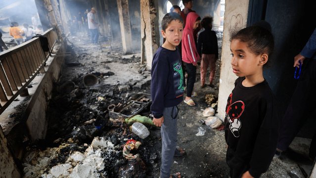 Palestinians inspect the damage at a school sheltering displaced people, following an Israeli strike, in Gaza City, on April 23, 2025. (Photo by Dawoud Abu Alkas/Reuters)