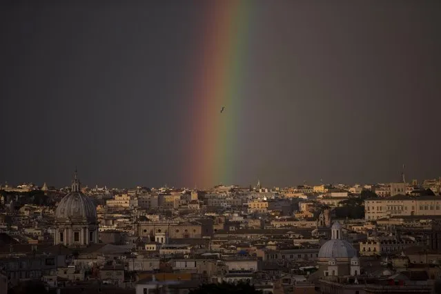 A rainbow forms over downtown Rome, Friday, March 27, 2015. (Photo by Alessandra Tarantino/AP Photo)