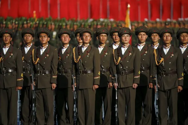 Soldiers listen to North Korean leader Kim Jong Un addressing the parade celebrating the 70th anniversary of the founding of the ruling Workers' Party of Korea, in Pyongyang October 10, 2015. (Photo by Damir Sagolj/Reuters)