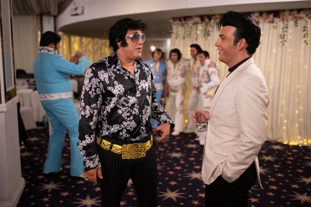 Elvis Presley tribute artists TC Memphis (L) and Jared Warne (R) chat backstage before the round one results were announced in the 'British Elvis Tribute Artist Championships' in Blackpool, north-west England on March 15, 2024. The contest, entitled “If I Can Dream”, takes place over 3 days and sees Elvis tribute artists from all over Britain and Europe compete for a place in the Ultimate Finals, to be held in Memphis Tennessee. (Photo by Oli Scarff/AFP Photo)