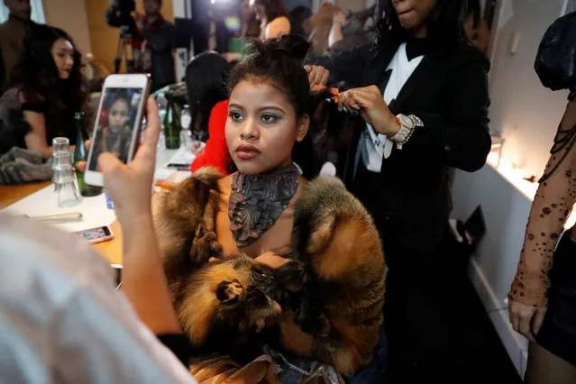 A model gets ready backstage before the #MeToo Fashion show during New York Fashion Week in New York, USA on February 9, 2018. (Photo by Elizabeth Shafiroff/Reuters)