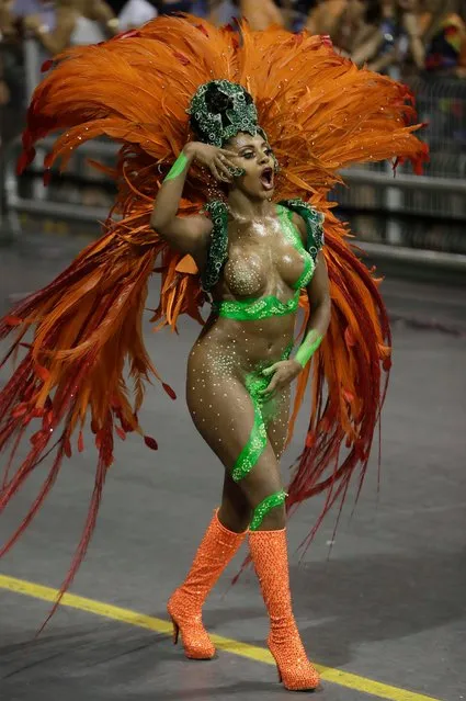A dancer from the X-9 Paulistana samba school performs during a carnival parade in Sao Paulo, Brazil, Saturday, February 10, 2018. (Photo by Andre Penner/AP Photo)
